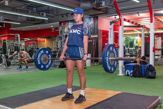 woman exercising fitness first