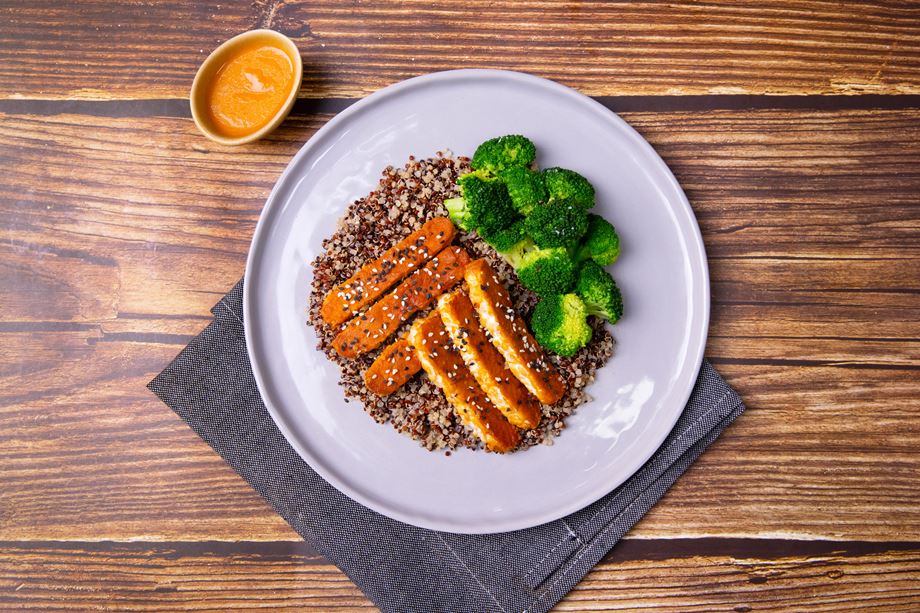 High-protein meals like this grilled honey miso tempeh with quinoa and broccoli dish are essential for healthy living. 